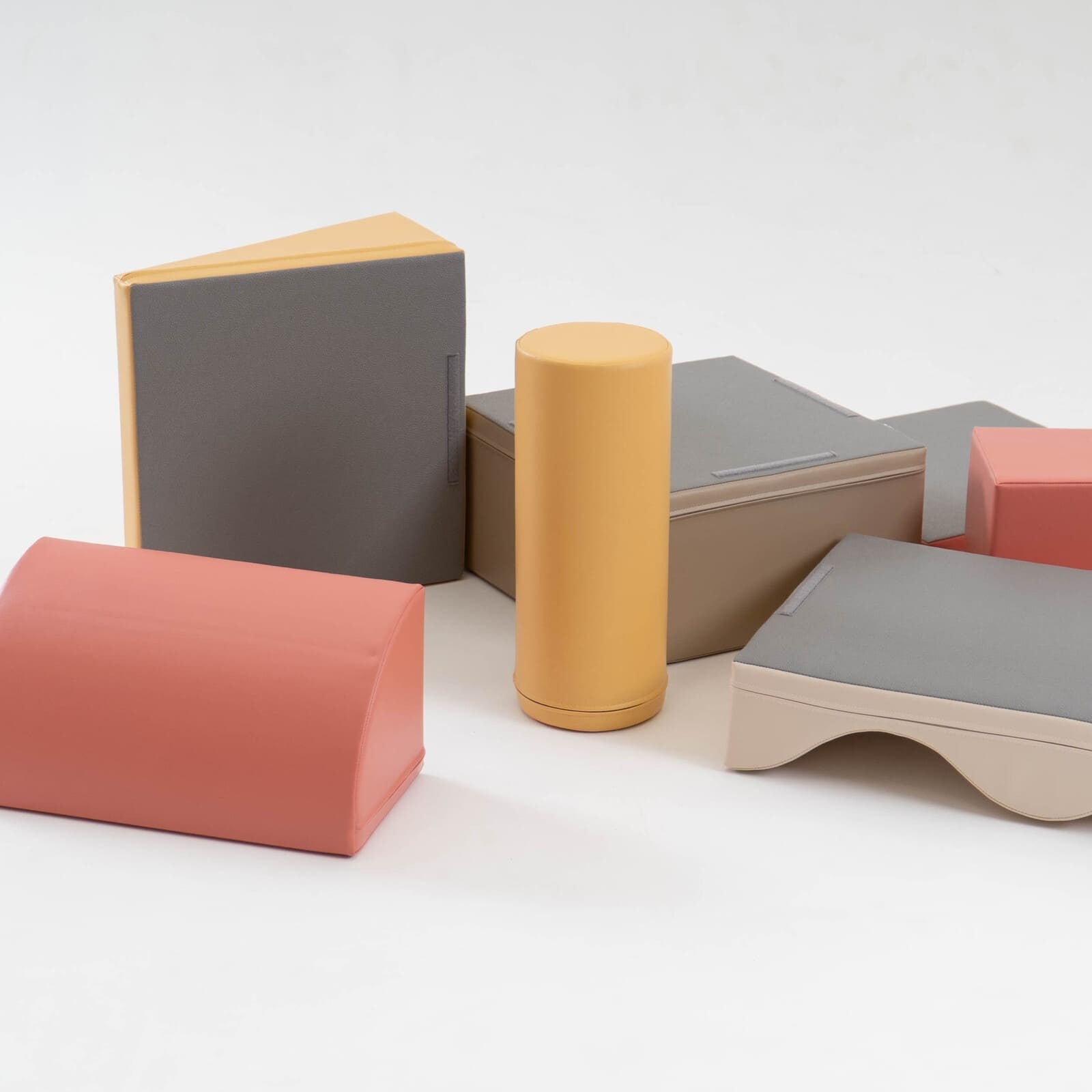 IGLU Discoverer foam block set in pastel pink, beige, gray, cream and yellow arranged in alternate angles