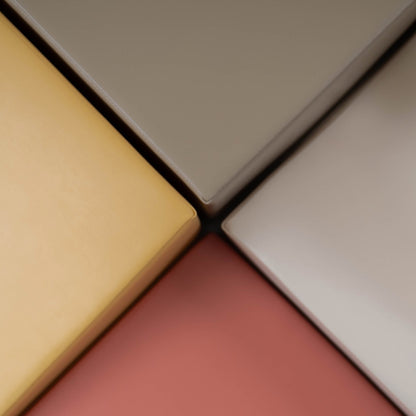 Close-up of foam block textures showing soft pastel pink, cream, gray and beige surfaces