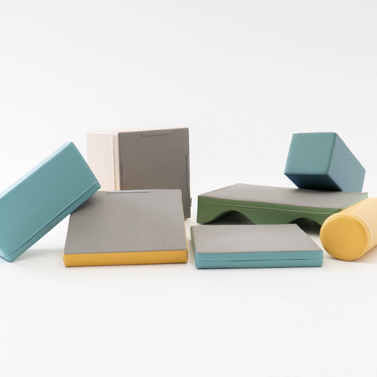 IGLU soft foam blocks scattered showing individual components including ramps, cylinders, and platforms