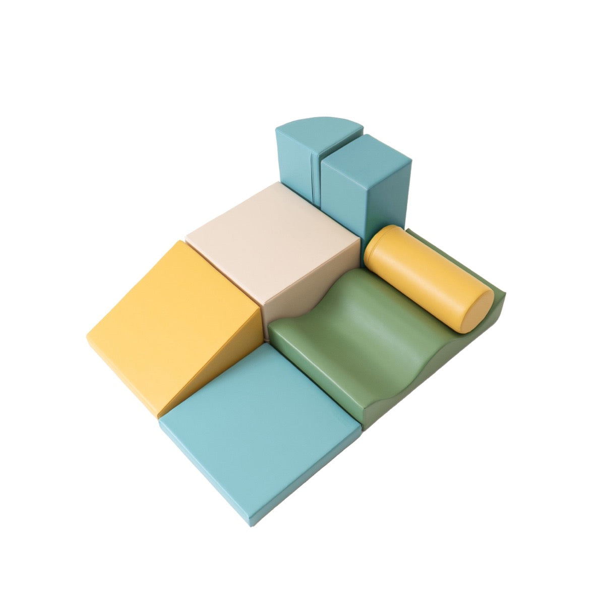 IGLU foam block set arranged showing layered construction with turquoise, yellow, green, and cream pieces