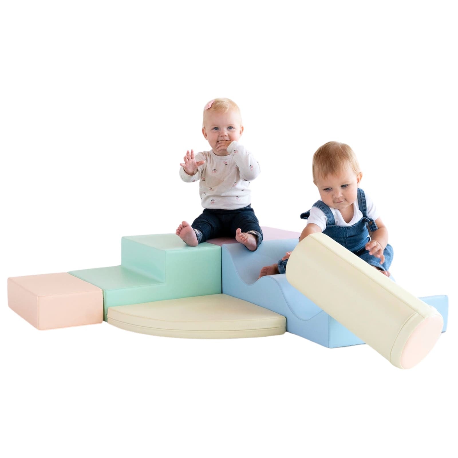 Two toddlers playing on assembled light pastel foam block structure with ramp