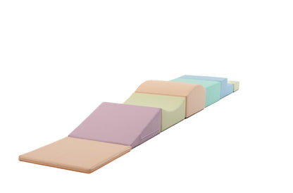 Side view of seven pastel foam blocks in angled stepping configuration