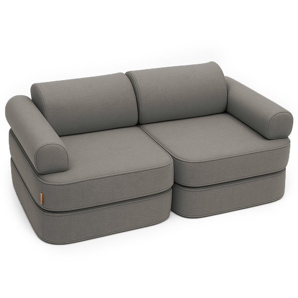 Clay taupe modular children's sofa with cushioned segments and rounded armrests arranged as a lounge