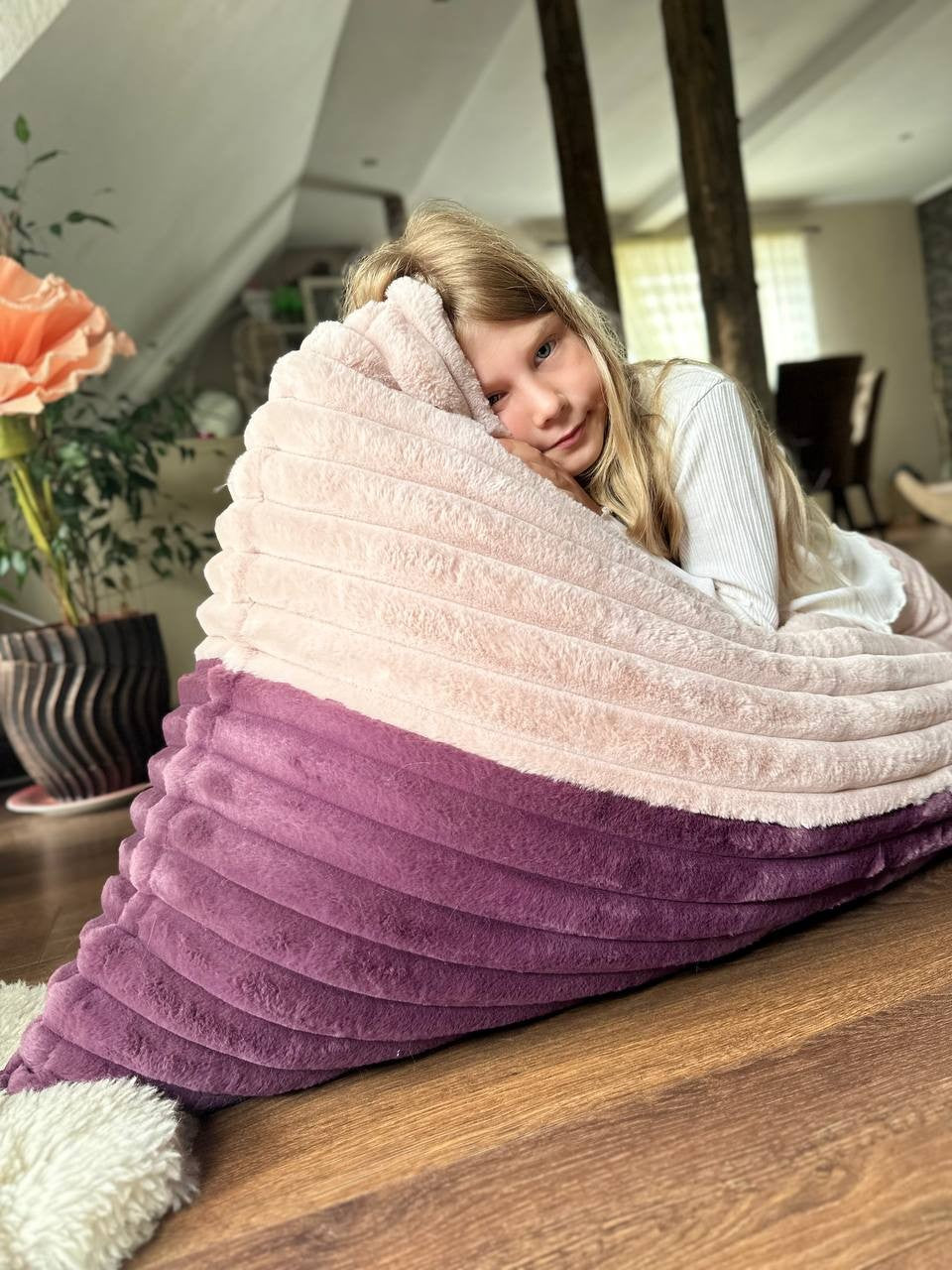 Girl wrapped in comfortable kids beanbag chair with layered pink and purple design