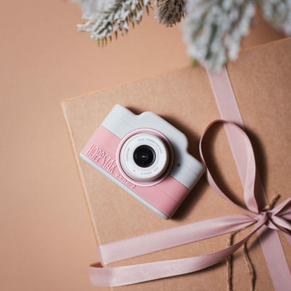 Hoppstar Expert Blush kids camera on a gift box with pink ribbon