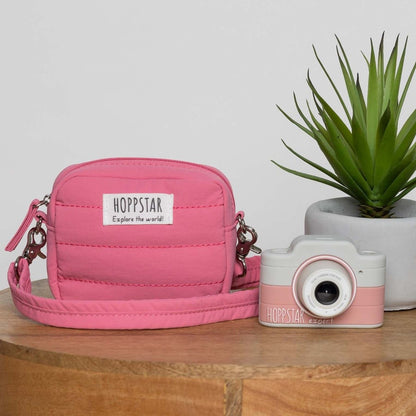 Pink Hoppstar camera bag beside the Hoppstar Expert Blush kids camera
