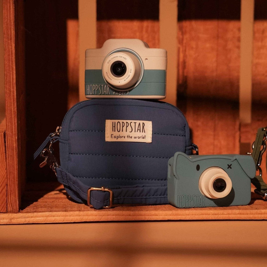 Hoppstar Expert Yale camera on a navy camera bag on a wooden shelf