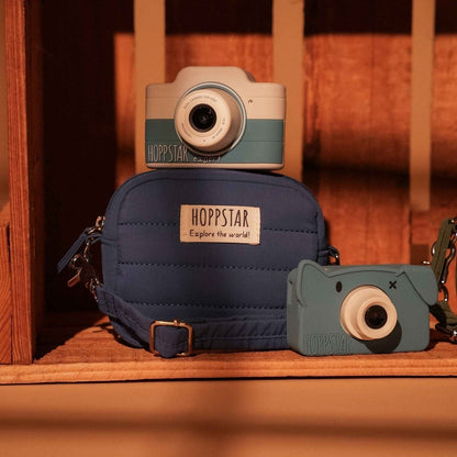 Hoppstar Expert Yale camera on a navy camera bag on a wooden shelf