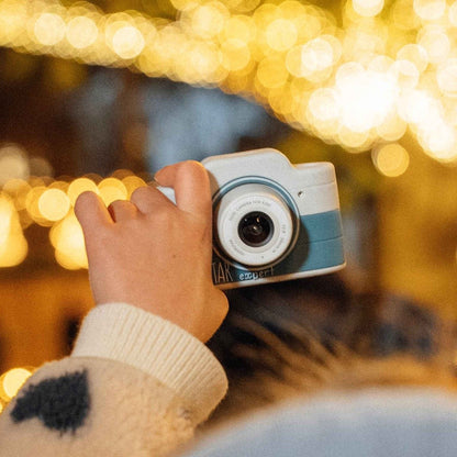 Child photographing Christmas lights with the Hoppstar Expert Yale camera