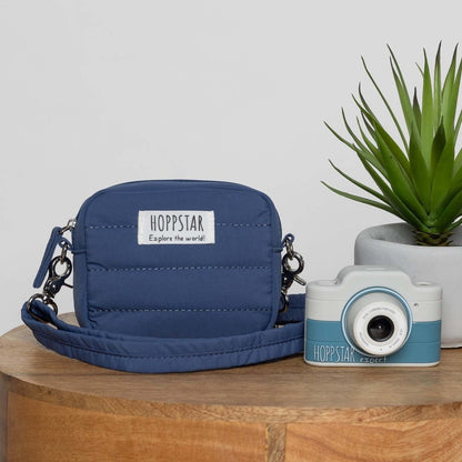 Hoppstar Expert Yale camera next to a navy Hoppstar camera bag