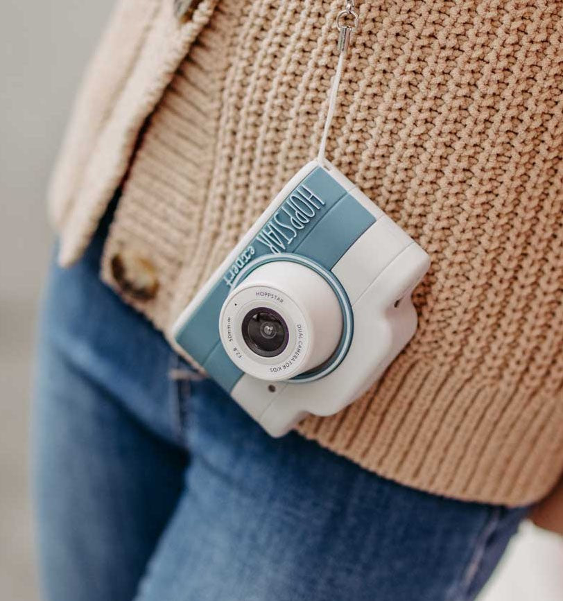 Hoppstar Expert Yale camera on a lanyard around a child's neck
