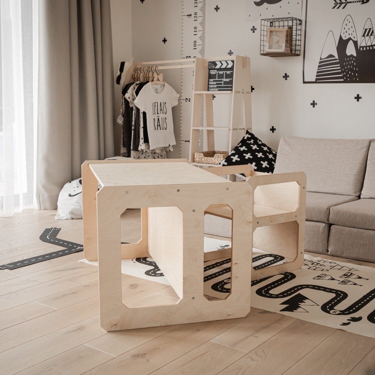 White Montessori table and chair set in minimalist nursery room setting