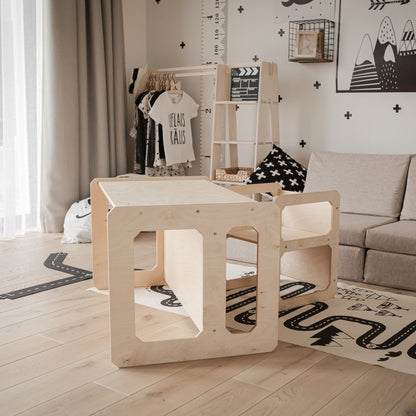 White Montessori table and chair set in minimalist nursery room setting