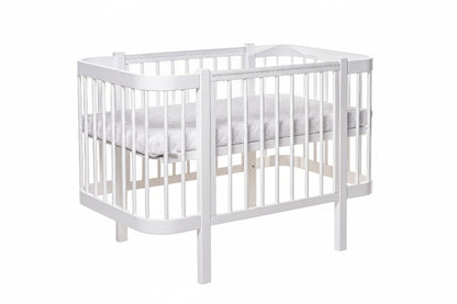 KOTTO Baby Crib ELIN with Mattress White Beechwood Bundle – angle view crib with beechwood legs | Nestling