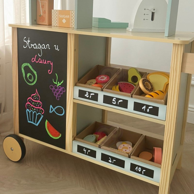 Wooden food truck stand with chalkboard displaying dairy items written in colorful chalk