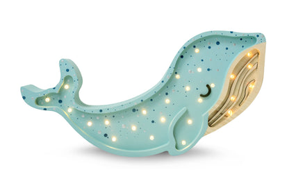Light blue whale-shaped wooden LED lamp with warm white lights and golden tail detail