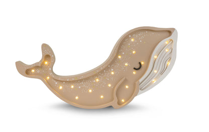 Tan and gold whale-shaped LED lamp with warm white lights and curved tail fin