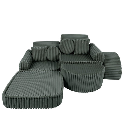 Forest green corduroy modular sofa showing curved chaise configuration with circular pillows