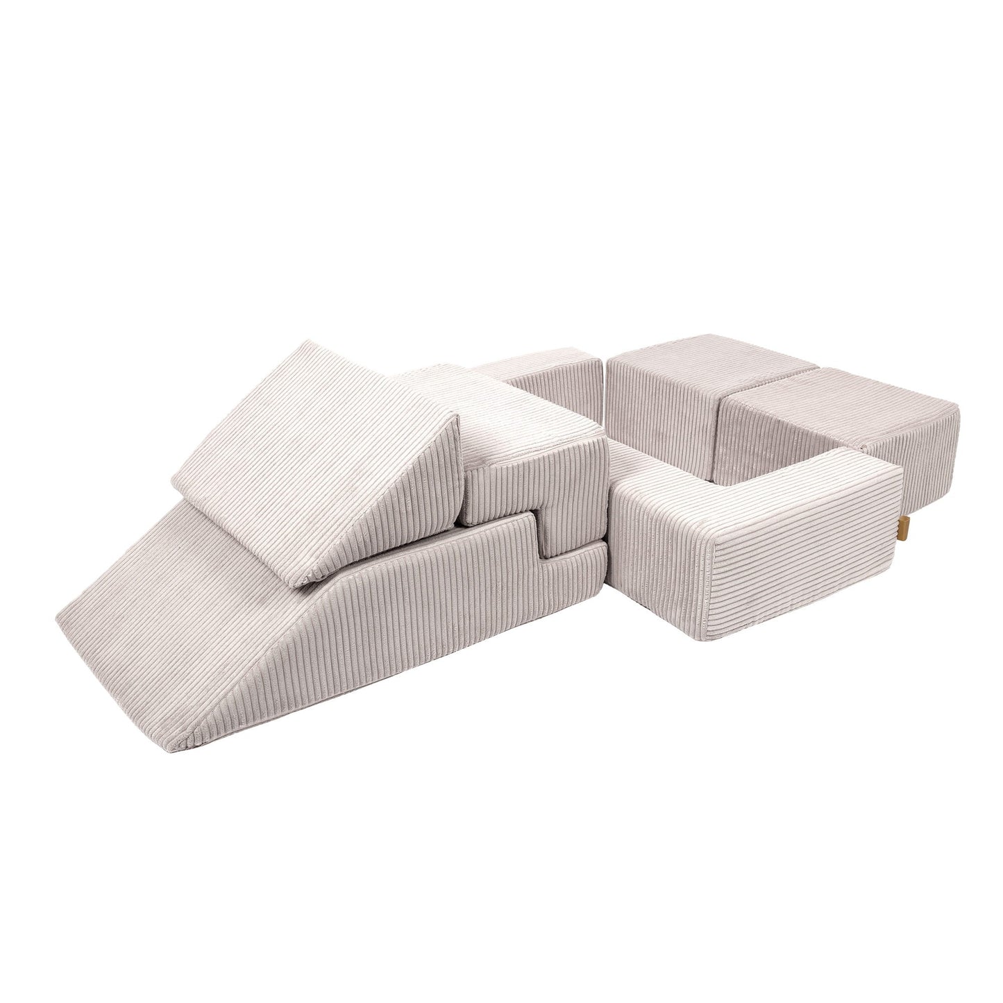 Ecru velvet bricks configured in sofa formation with open ball pit compartment