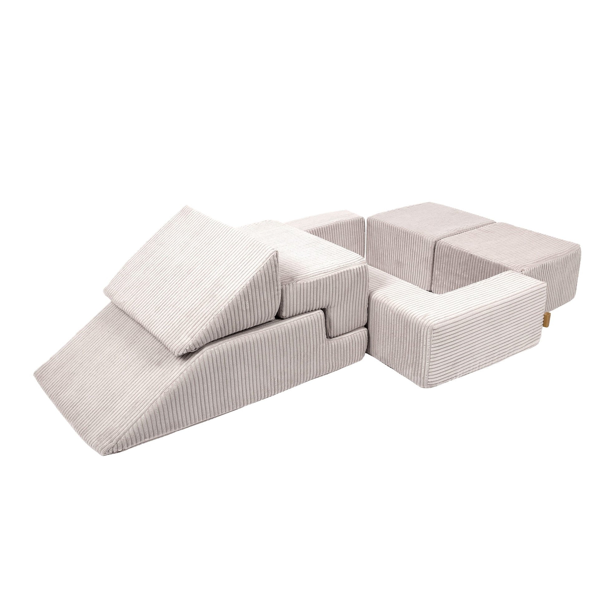 Ecru velvet bricks configured in sofa formation with open ball pit compartment