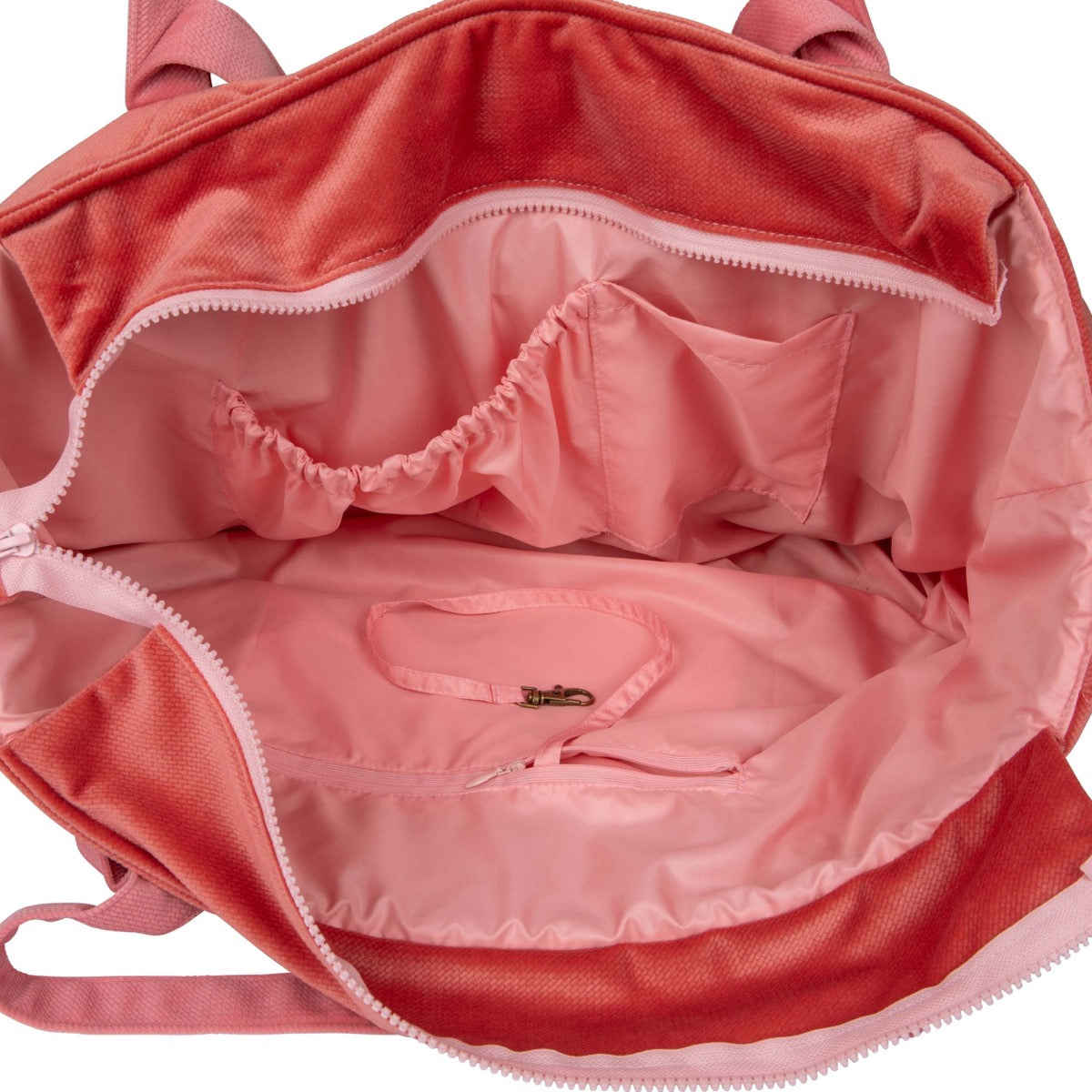 Interior of candy pink mom bag showing waterproof lining and multiple organized pockets
