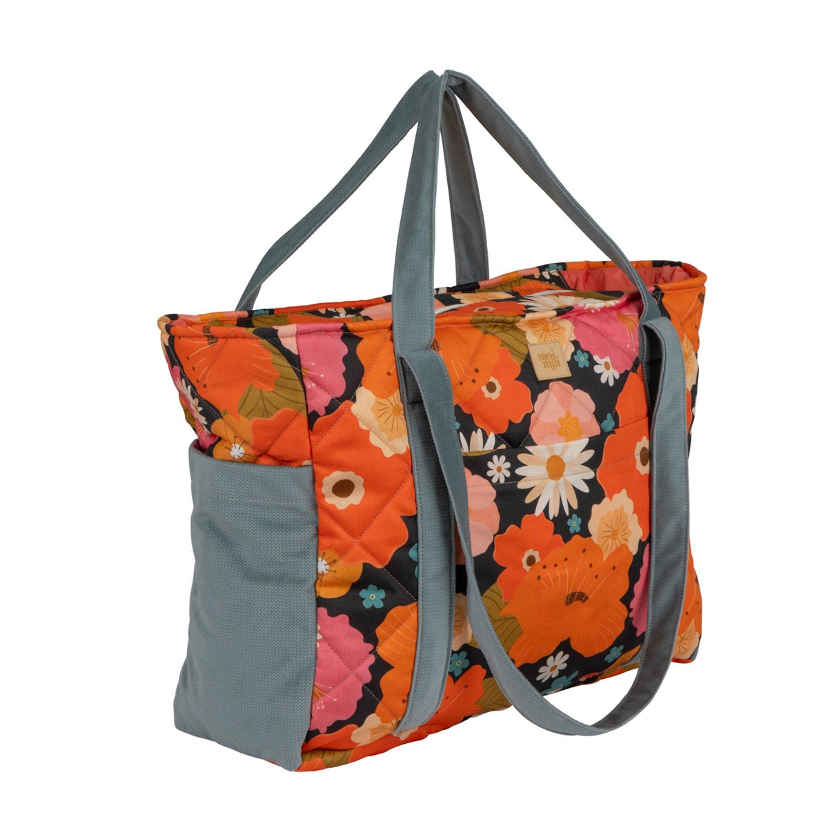 Side angled view of colorful floral velvet cotton weekender bag with gray handles