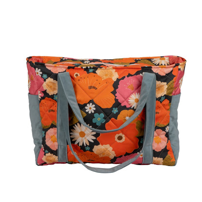 Top down view of flower print baby weekender bag showing spacious interior capacity