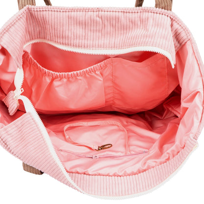 Interior view of pink coffee weekender bag showing waterproof lining and pockets