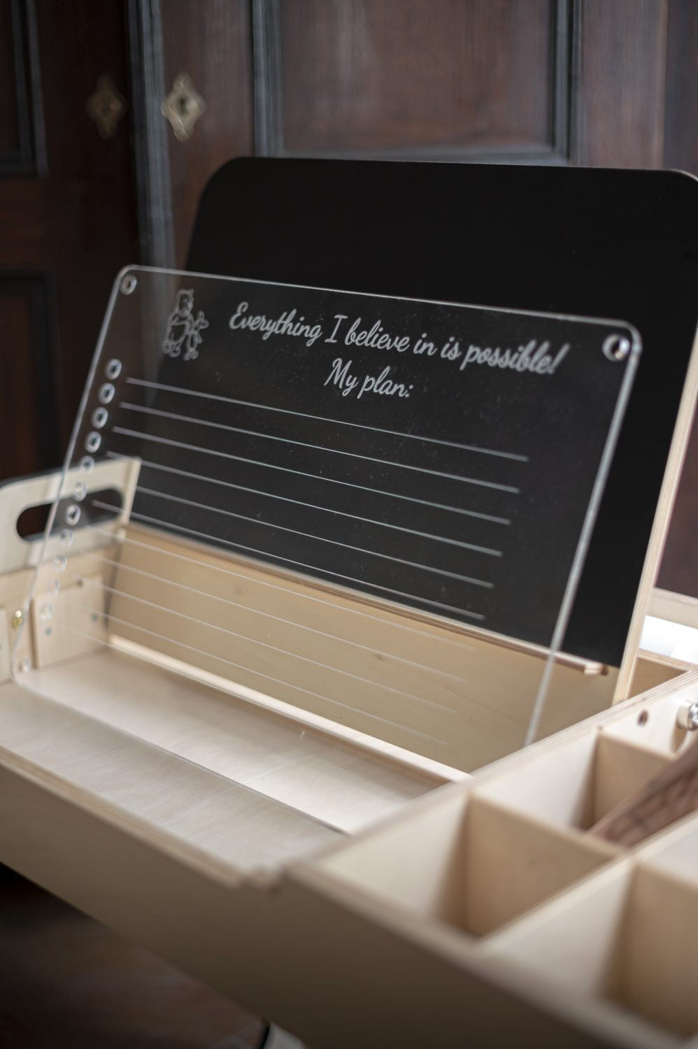 Close-up of chalkboard panel insert with motivational text in Julle art table