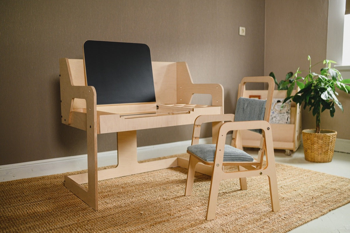Luula birch art table with black easel and matching wooden chair in playroom setting