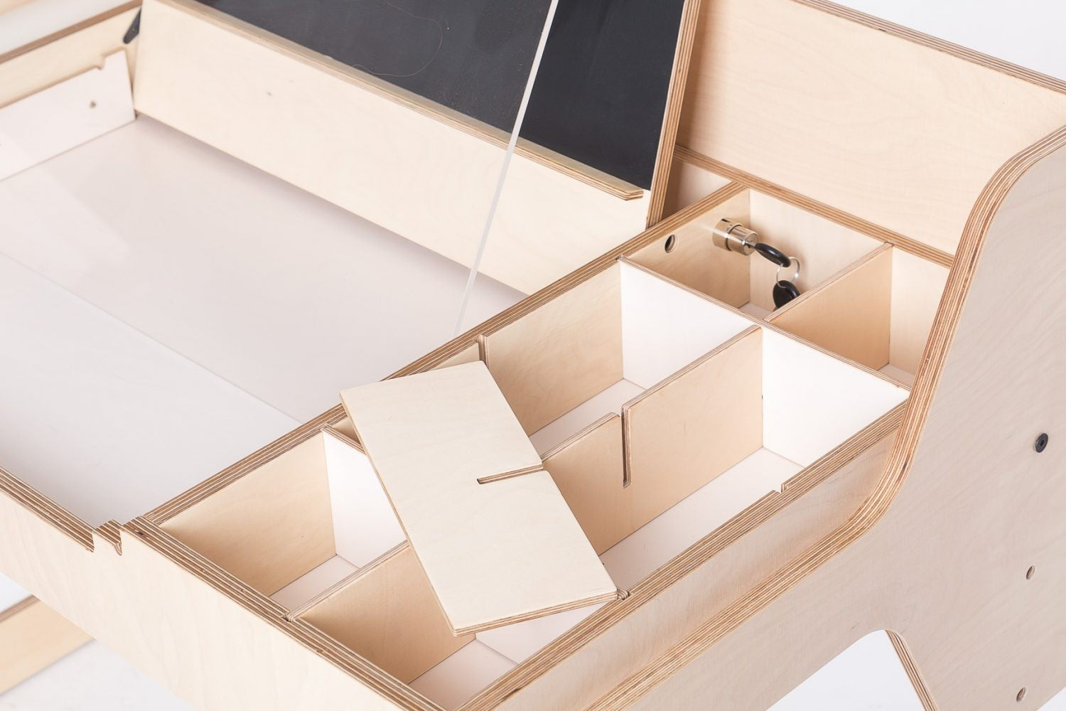 Interior view of Luula table compartments with organized storage dividers