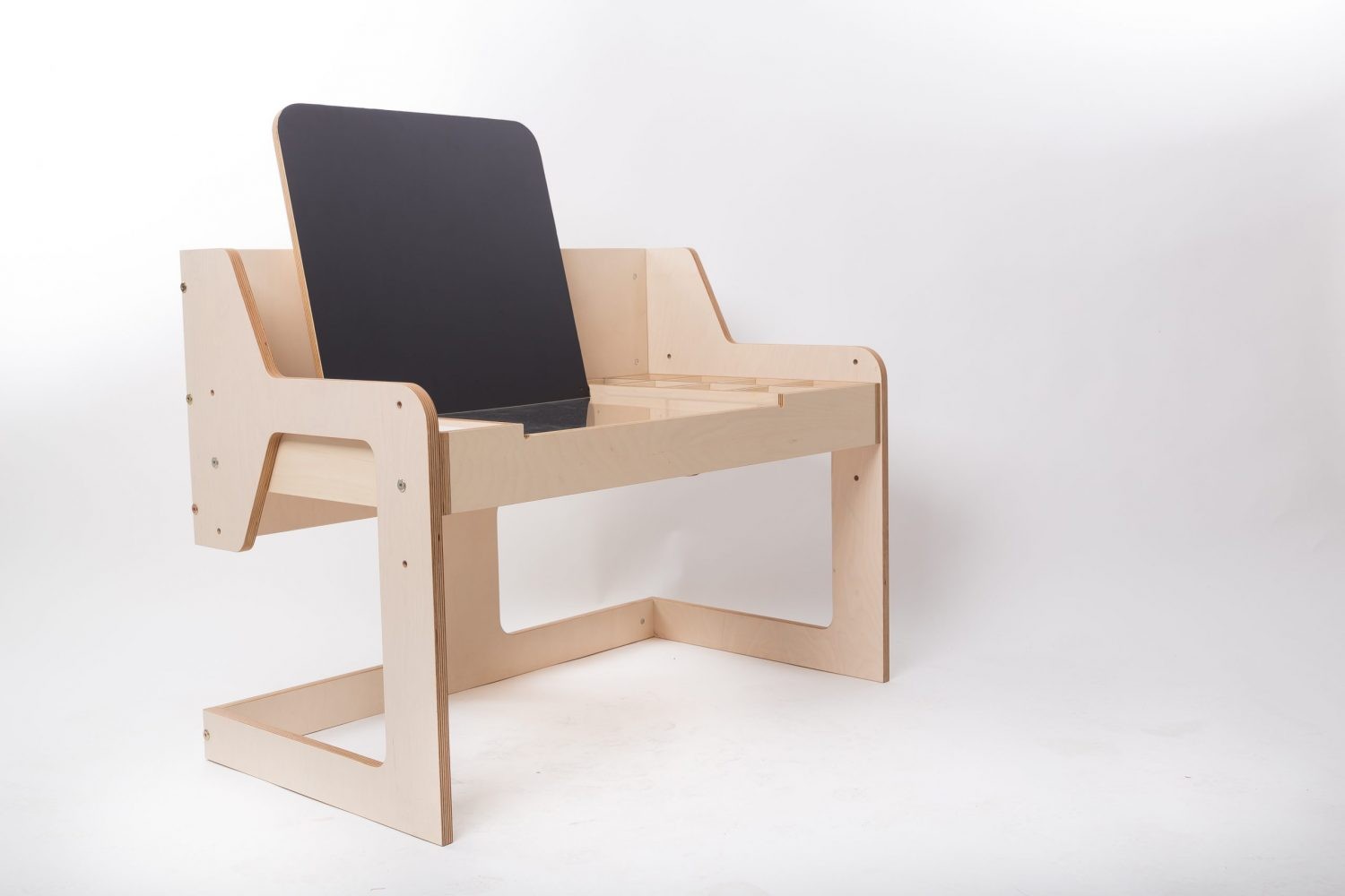 Angled side view of Luula art table with adjustable black chalkboard easel