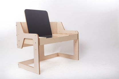Angled side view of Luula art table with adjustable black chalkboard easel