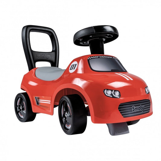 Red Smoby ride-on car with black handle and steering wheel, front angle view