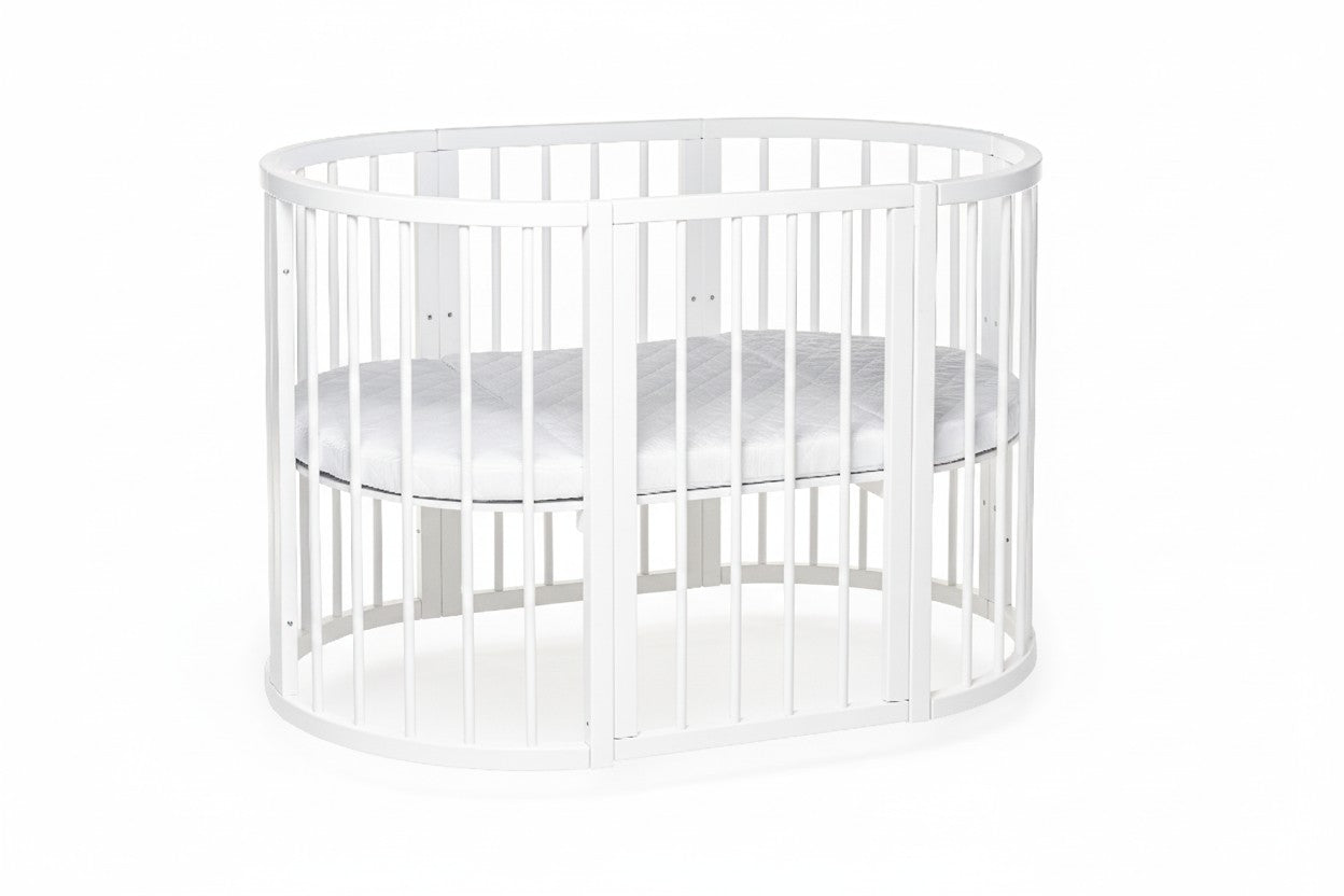 White round crib OLIN front view with full enclosure and single mattress height position