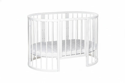 White beech wood round crib side angle showing curved rails and mattress support system
