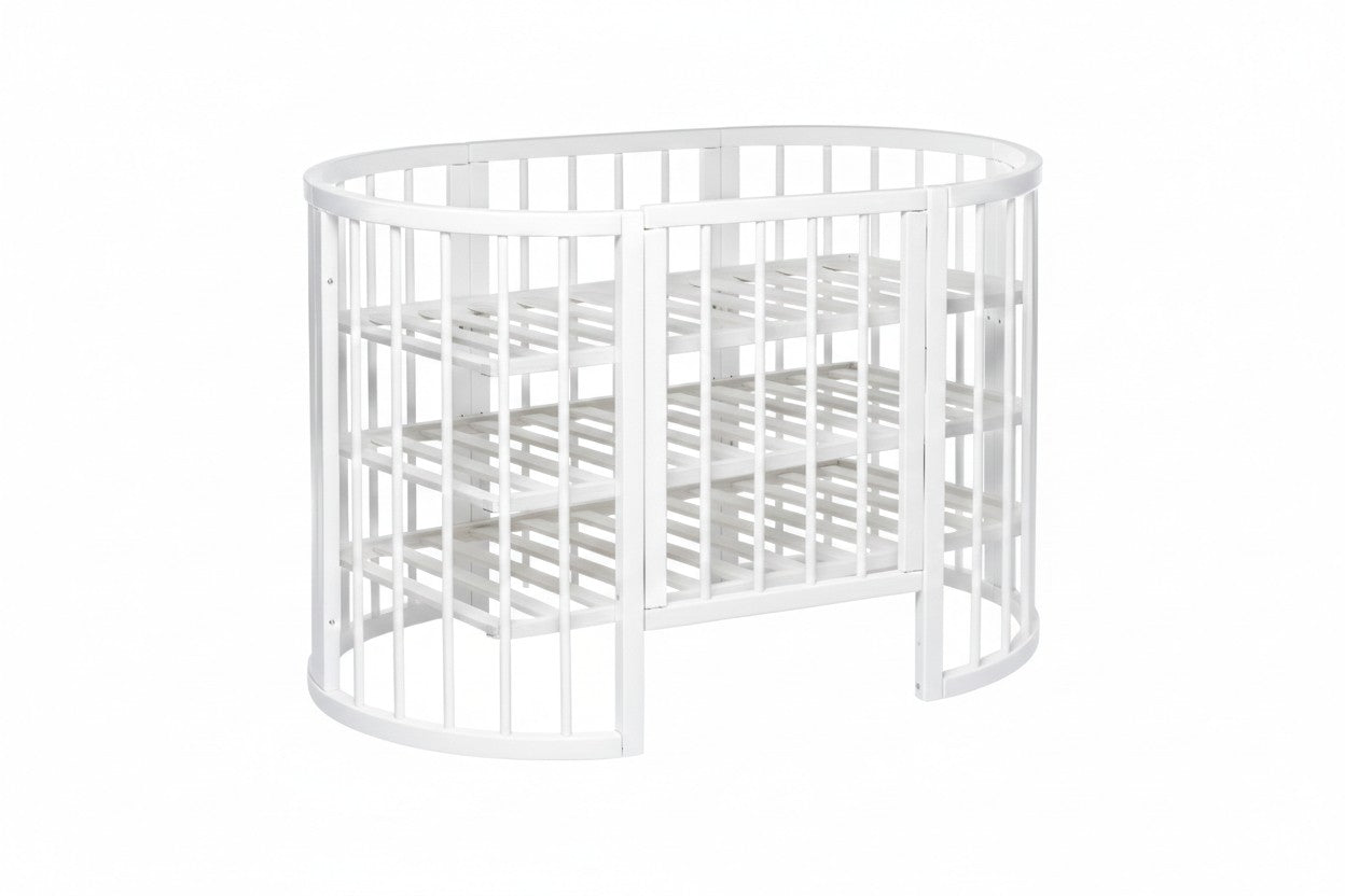 White round baby crib OLIN side view with wheels and open gate configuration for bedside use