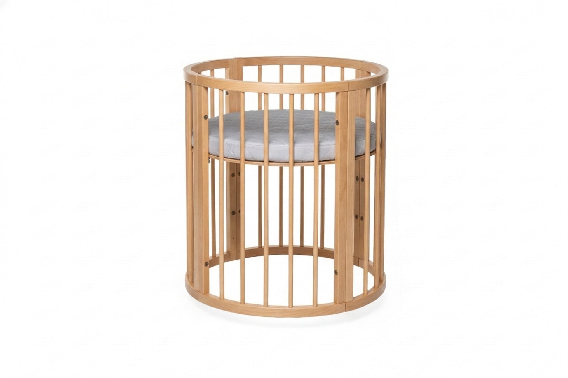Round beechwood crib with removable side panel and white mattress