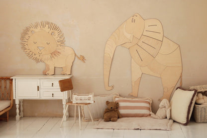 Wooden safari lion and elephant wall decor displayed in neutral nursery room setting