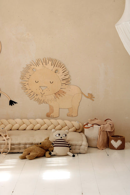 Safari lion wooden wall decoration positioned above rope floor mat in kids room