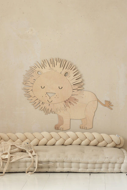 Close-up of wooden lion wall art showing detailed mane and gentle facial features