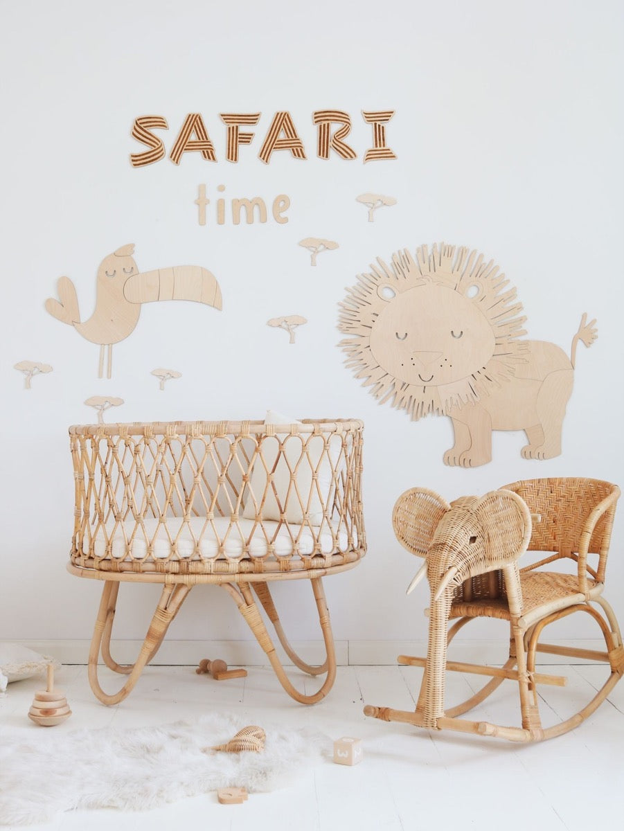 Complete Safari Toucan wall decor set displayed with wicker bassinet, chair, and rocking chair in nursery