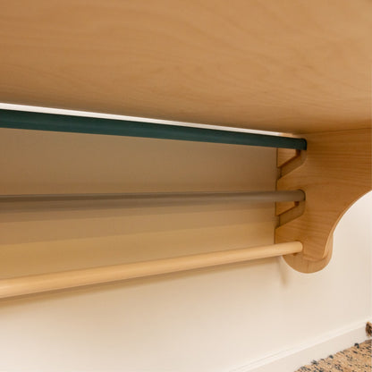 Close-up of Swedish wall shelf attachment showing birch plywood construction and finish