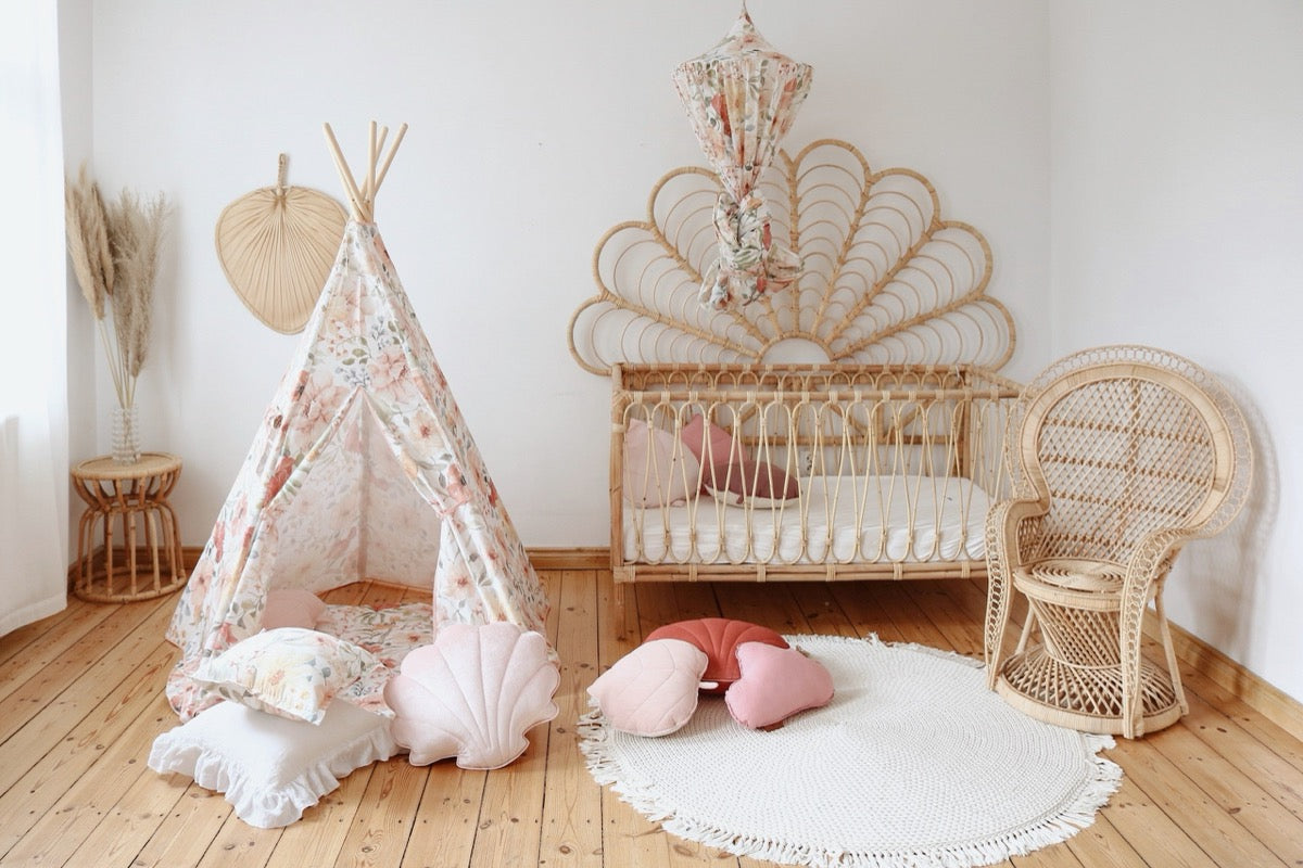 Flower Power teepee in baby nursery with crib, woven chair, and matching cushions