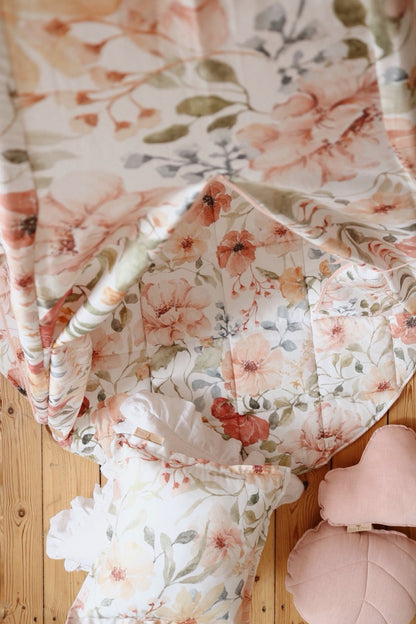 Close-up of teepee fabric showing hand-painted red and pink flowers with green leaves