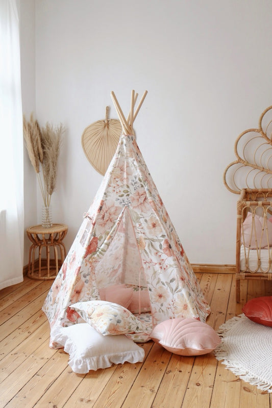 Flower Power teepee tent set up in bedroom with pink cushions and floral pattern fabric