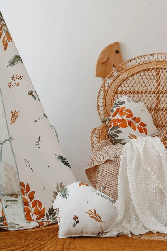 Close-up of Forest Friends teepee fabric showing autumn leaves and forest creatures design
