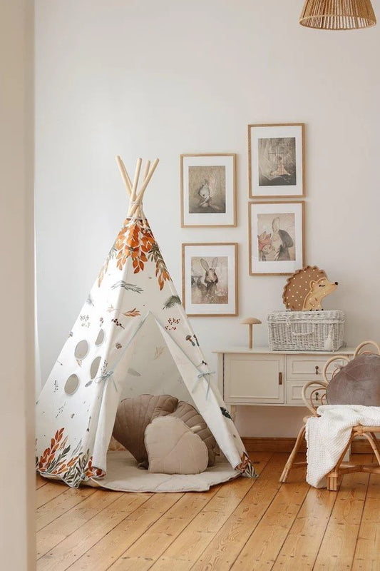 Forest Friends teepee tent set up in bedroom with woodland pattern and cushions inside