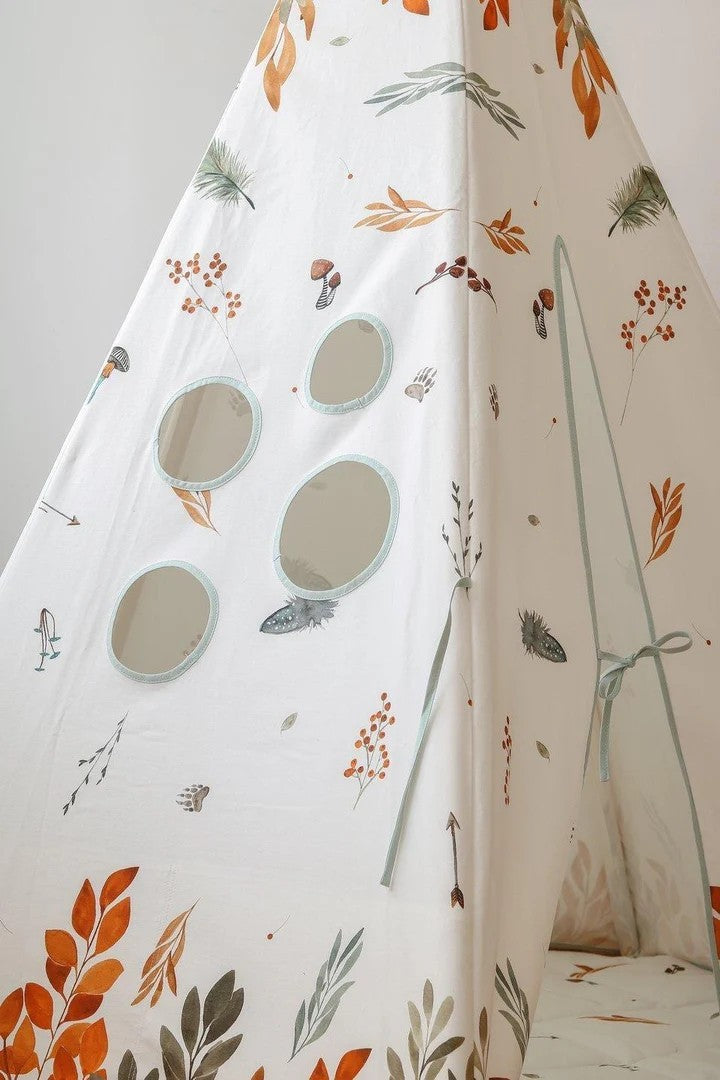 Detail of teepee side panel showing window cutouts and woodland leaf pattern