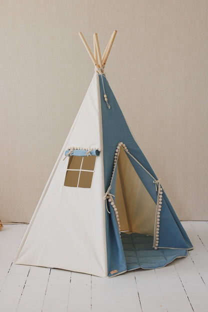Jeans teepee tent with white and blue denim, window with pom pom trim, and open entrance door